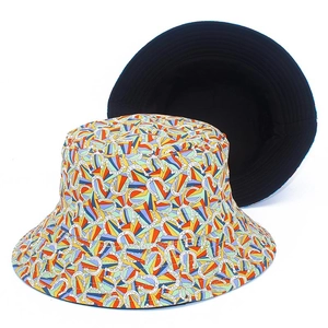 Double-sided cotton bucket hat featuring colorful vintage horseshoe print and plain black side