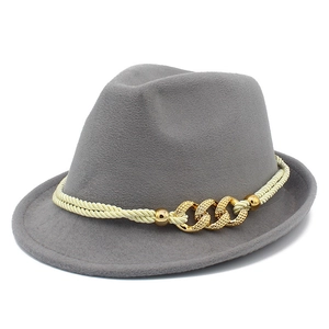 Classic grey fedora hat with elegant gold chain and rope band detail on white background