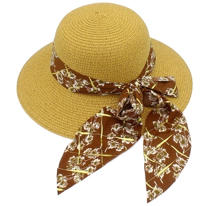 Elegant women straw sun hat with floral chiffon ribbon bow for summer beach vacation