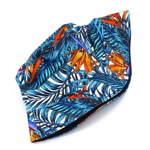 Double-sided cotton bucket hat with tropical blue leaves and orange floral pattern