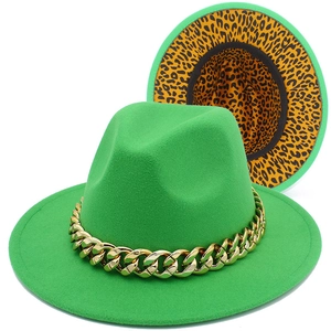 Green wool jazz fedora hat with gold chain and leopard print lining on white background