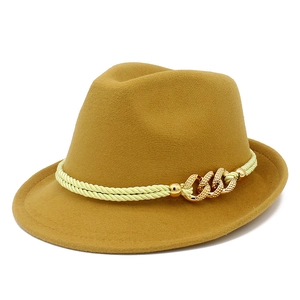 Classic mustard yellow felt fedora hat with green braided band and gold chain links