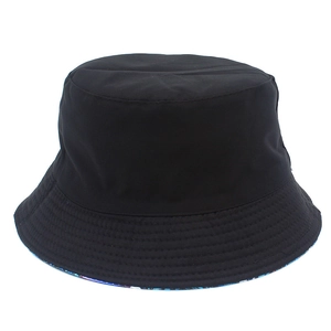 Detail of black cotton bucket hat showing reinforced stitching and geometric floral lining