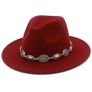Detail of burgundy wool fedora featuring a vintage silver metal chain accent