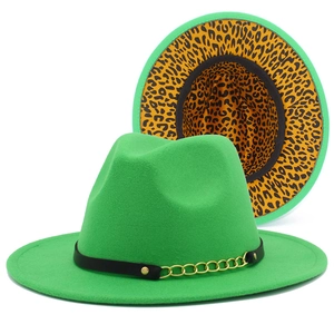 Close-up of green fedora hat featuring leopard print lining and golden chain decoration