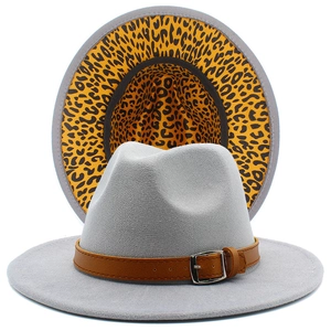 Detail of wide brim fedora hat showing grey felt texture and leopard print lining