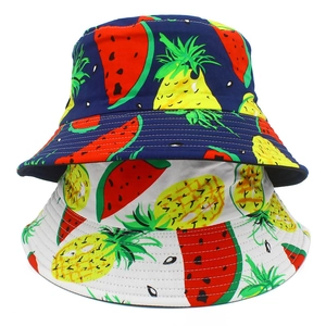 Reversible cotton bucket hats with watermelon and pineapple fruit patterns in navy and white