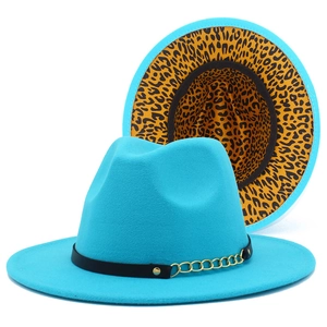 Detail of blue wool fedora featuring black leather band and orange leopard print lining