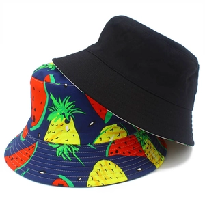 Reversible cotton bucket hat featuring colorful fruit prints and classic solid black design