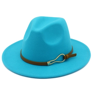 Detail of blue fedora hat with brown leather band and gold buckle on a wide flat brim