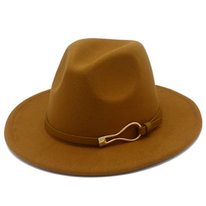 Detail of classic wide brim fedora with leather band and gold teardrop buckle