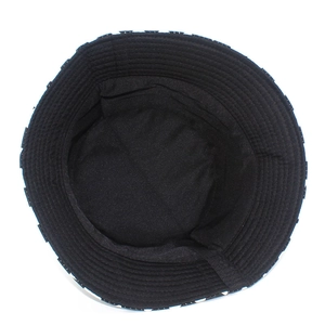 Detail of the inner black cotton lining and checkerboard pattern brim on bucket hat