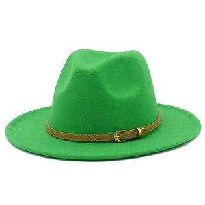 Detailed close-up of bright green wool fedora with a slim brown leather belt and buckle