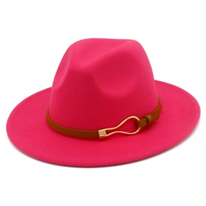 Detail of wide brim jazz hat in rose red felt with brown leather belt and gold buckle