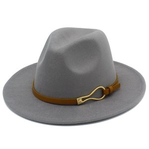 Detail view of a gray felt fedora hat featuring a brown leather band and golden buckle