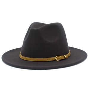 Detail of broad brim fedora featuring a decorative brown leather belt and gold buckle