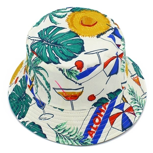 Detail of white cotton fisherman hat featuring tropical leaf prints and ALOHA text