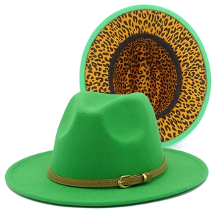Detailed view of green fedora hat featuring leopard print lining and leather buckle strap