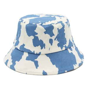 Classic cotton bucket hat featuring stylish blue and white cow print for outdoor wear