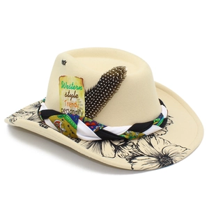 Detail of beige wool fedora featuring floral brim print, woven band, and spotted feather