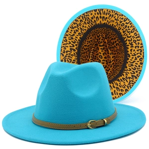 Detail of teal wool fedora hat with leopard print underbrim and brown leather strap buckle