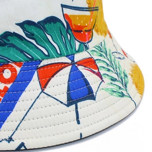 White cotton sun hat with tropical prints and reinforced brim stitching for women