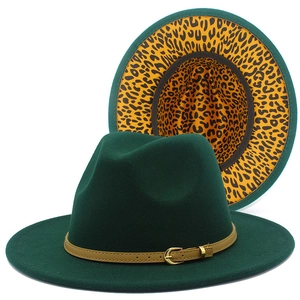 Detail of dark green fedora hat featuring leopard print lining and a leather belt buckle