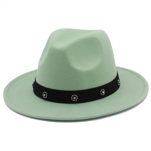 Detail of light green wool felt fedora with black ribbon and shimmering rhinestone accents