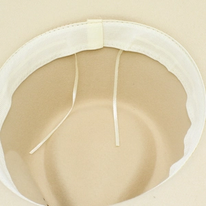 Detail of wool felt fedora interior showing adjustable drawstring and sweatband
