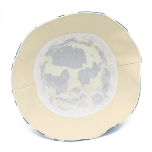 Detailed interior of a cotton bucket hat showing stitching and canvas fabric texture