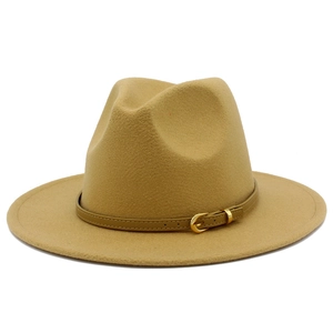 Close-up of camel wide-brim fedora hat with elegant leather band and gold metal buckle