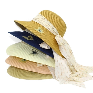 Women's wide brim straw sun hats with floral ribbon and butterfly detail in five colors