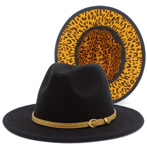 Black fedora hat with leopard print brim interior and brown leather belt buckle