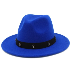 Detail of royal blue fedora hat with elegant black band and sparkling rhinestone buckle