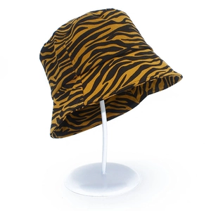 Detailed macro view of vibrant orange zebra print cotton bucket hat with black stripes