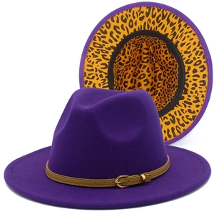 Detail of purple felt fedora with brown leather band and yellow leopard print brim