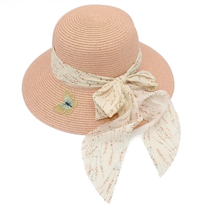 Pink wide brim straw sun hat for girls featuring a floral ribbon bow and butterfly patch
