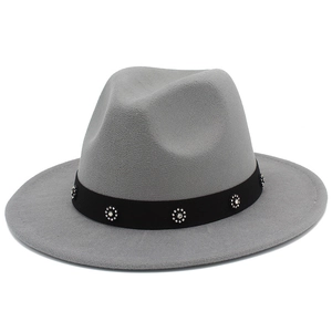 Detailed close-up of grey wool fedora hat featuring black band with rhinestone flowers