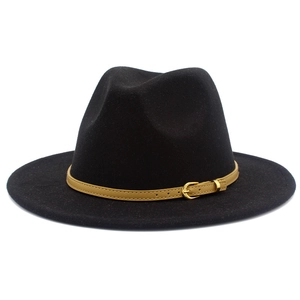 Detail of black wool fedora hat featuring a light brown leather band with gold buckle