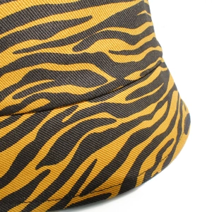 Zebra pattern bucket hat in yellow and black canvas with detailed twill fabric texture