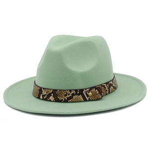 Detail of mint green wool fedora hat featuring a stylish snakeskin band and gold rivet