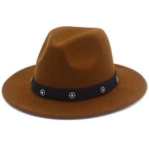 Detail shot of caramel brown wool fedora featuring floral rhinestone buckle on black band
