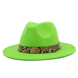 Detail of neon green wool fedora hat featuring snake skin pattern belt with gold stud