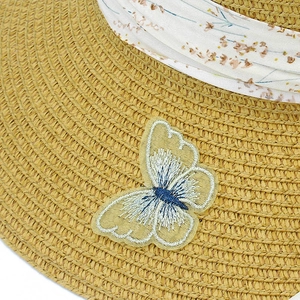 Women's wide brim straw sun hat with elegant butterfly embroidery and floral ribbon detail