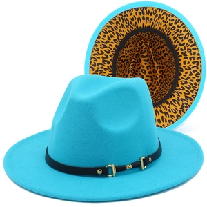 Detail of blue wool felt fedora featuring a leopard print underbrim and black gold buckle