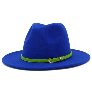 Macro detail of bright blue wool fedora featuring a neon green thin leather belt