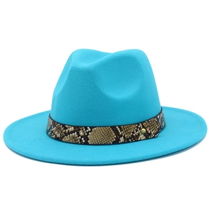 Detail of teal fedora hat featuring a snakeskin leather band and gold stud accent