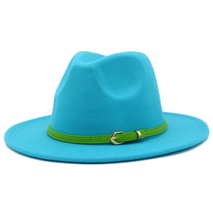 Close-up of bright blue wool fedora hat with green faux leather belt and gold buckle