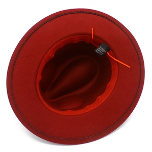 Detail of burgundy fedora hat interior showing the size adjustment cord and fabric label