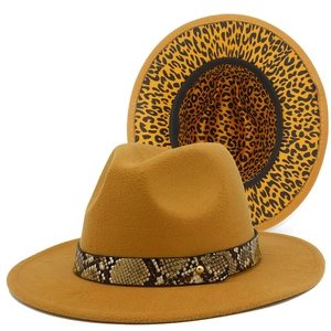 Detail of camel fedora hat featuring snakeskin band and leopard print underbrim
